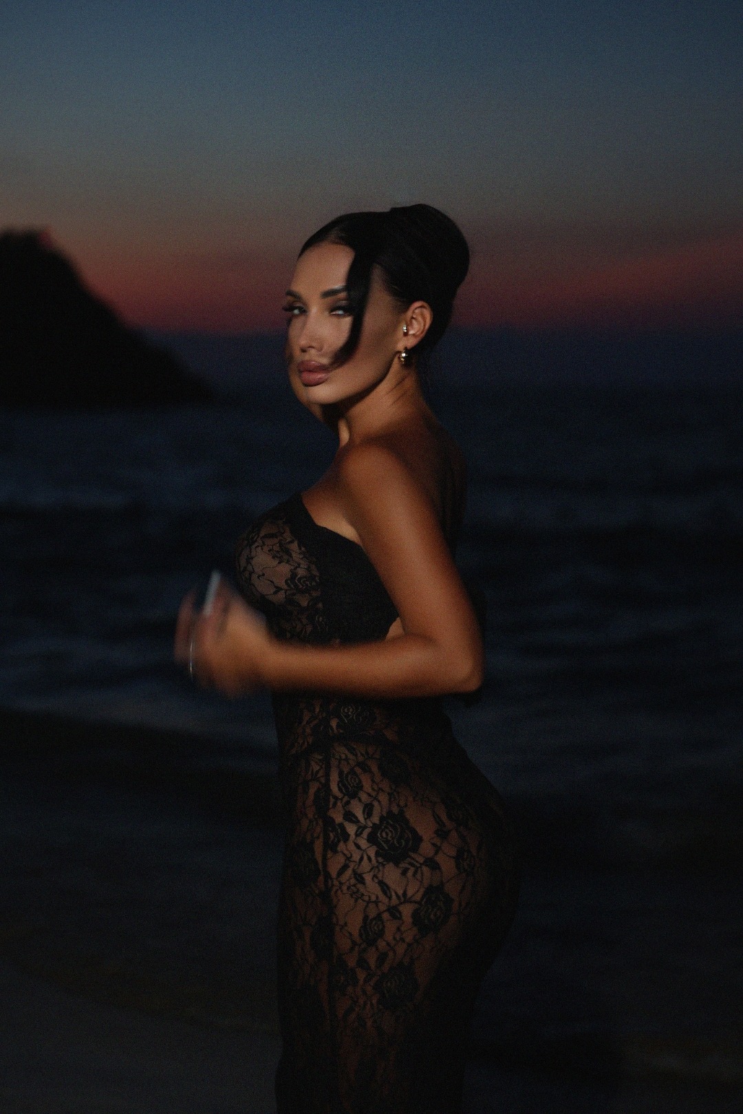 Kira Ilina at the beach at night